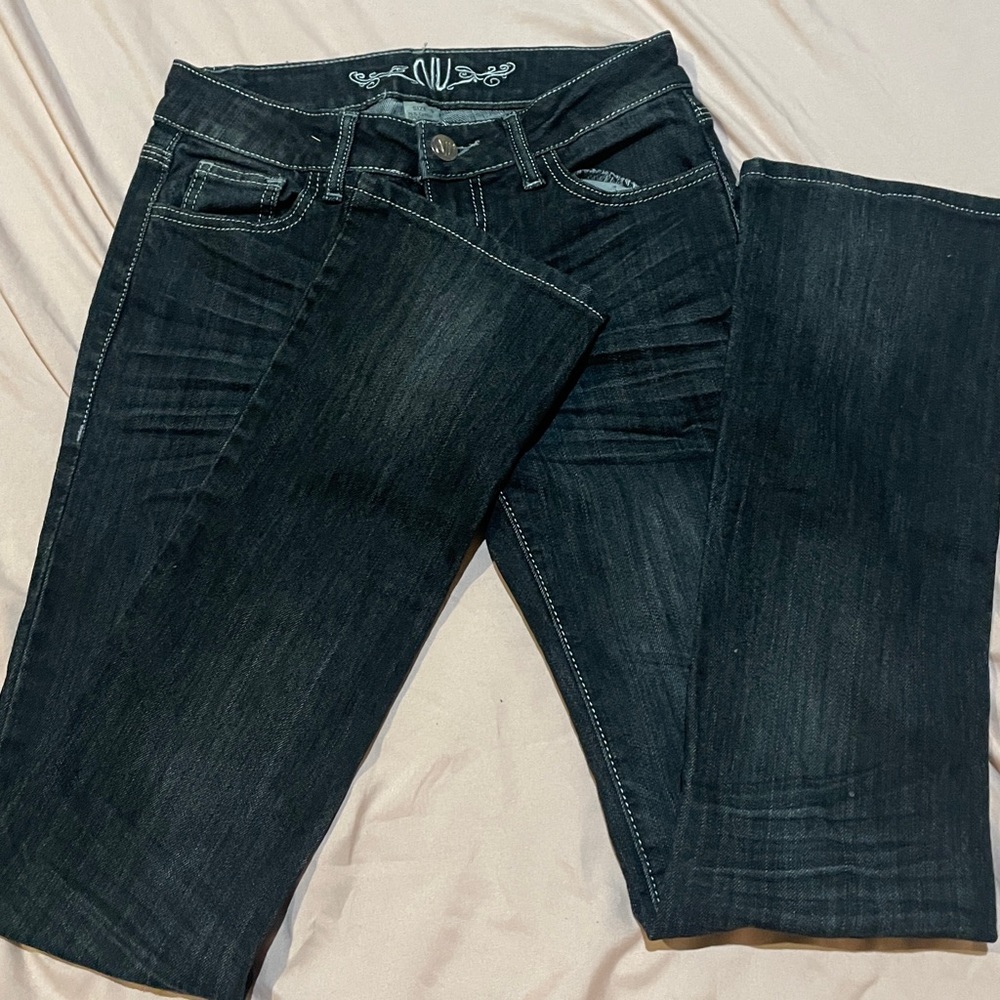 These are low waisted jeans with white stitching